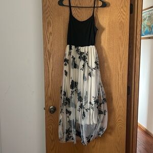 Long spaghetti strap dress with butterfly toole skirt.